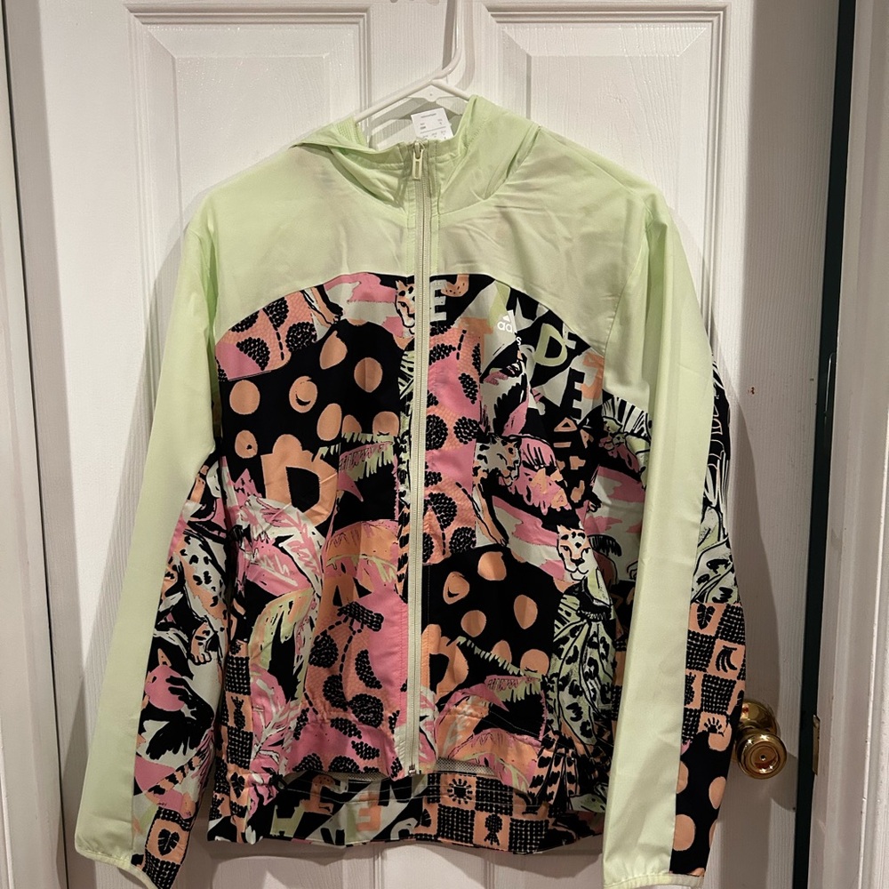 This product is an Adidas colorful wind breaker in the size M  in women’s